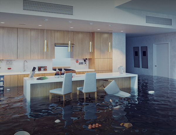 water flooding a home's kitchen