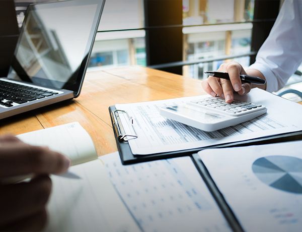 Hand using a calculator